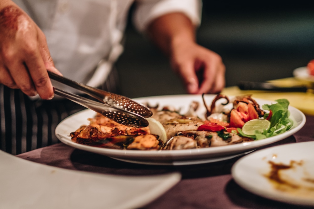 A chef plating a delicious meal at one of the top restaurants in McMinnville